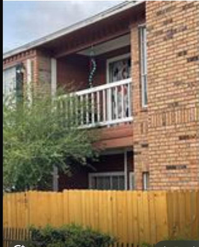 view of home's exterior featuring a balcony