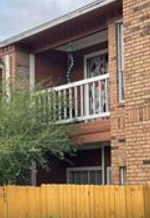 view of property exterior featuring a balcony