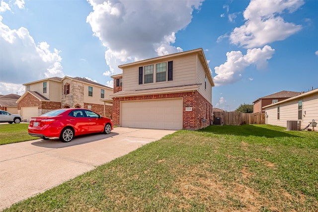 view of front property featuring central AC unit, a garage, and a front yard