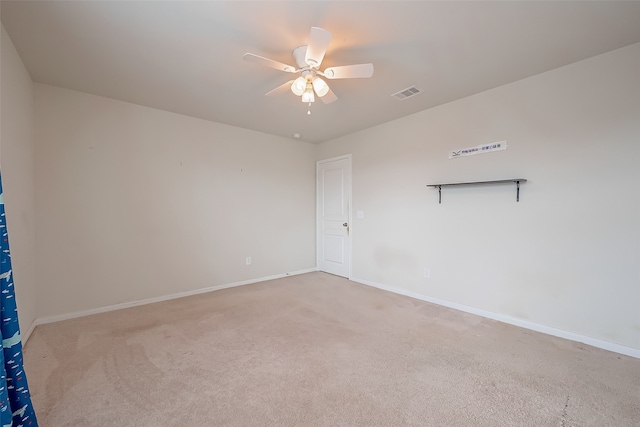 carpeted empty room featuring ceiling fan