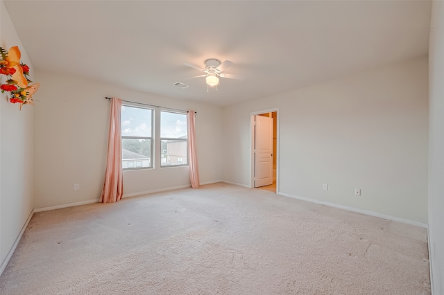 carpeted empty room with ceiling fan