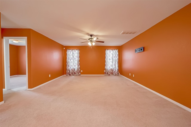 carpeted empty room with ceiling fan