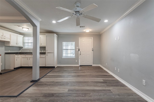 foyer featuring ornamental molding, ceiling fan, sink, and dark hardwood / wood-style flooring