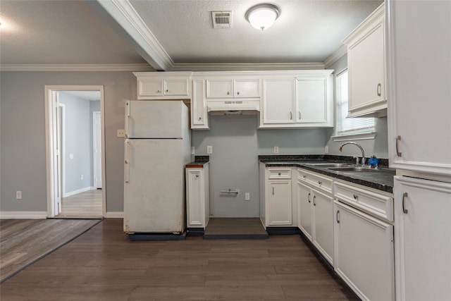 kitchen featuring white cabinetry, dark hardwood / wood-style floors, sink, and white fridge