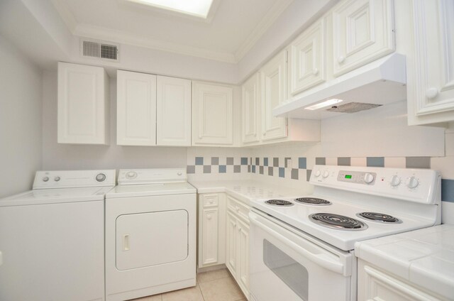 kitchen with white electric stove, white cabinets, visible vents, and under cabinet range hood