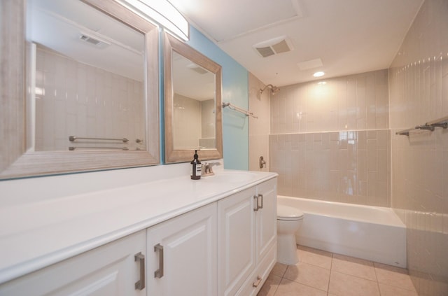 bathroom featuring bathtub / shower combination, visible vents, toilet, vanity, and tile patterned flooring