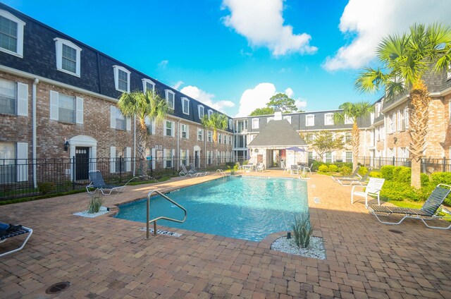 view of swimming pool with a patio area