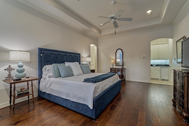 bedroom with ceiling fan, a raised ceiling, ornamental molding, beverage cooler, and dark wood-type flooring