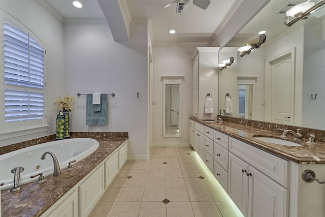 bathroom featuring ceiling fan, vanity, ornamental molding, and a tub