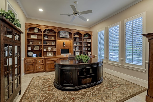 office area with ceiling fan, built in desk, and ornamental molding