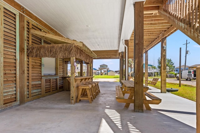 view of patio featuring an outdoor bar