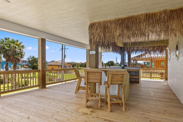 wooden terrace featuring an outdoor bar