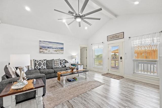 living room featuring beamed ceiling, ceiling fan, high vaulted ceiling, and light hardwood / wood-style floors