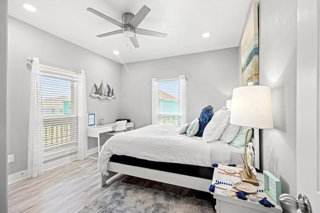 bedroom featuring wood-type flooring and ceiling fan