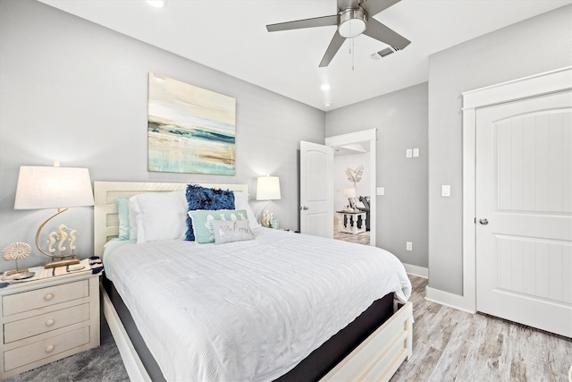 bedroom with ceiling fan and light wood-type flooring