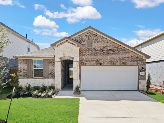 view of front of property with a garage and a front lawn