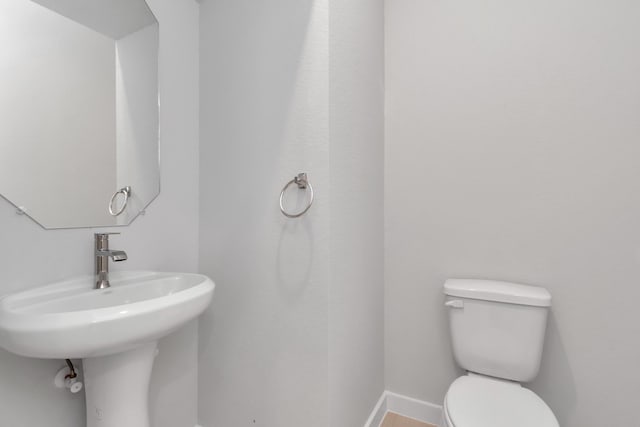 bathroom with sink and toilet