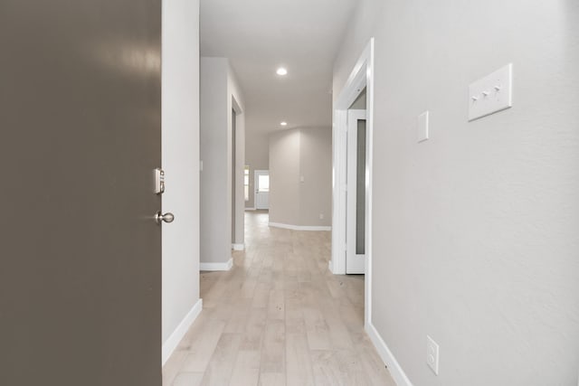 hall with light wood-type flooring