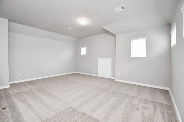 spare room with light carpet