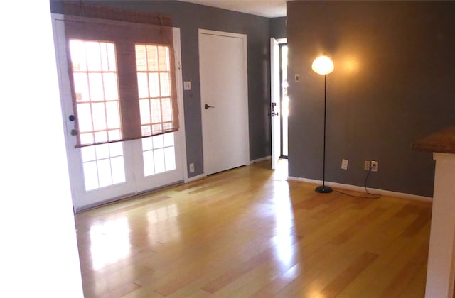 spare room with light hardwood / wood-style floors