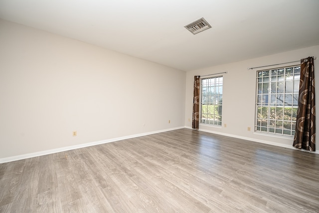 spare room featuring light wood-type flooring