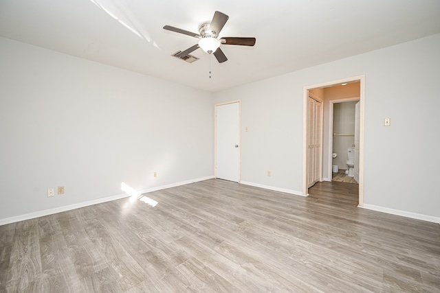 unfurnished room featuring ceiling fan and light wood-type flooring