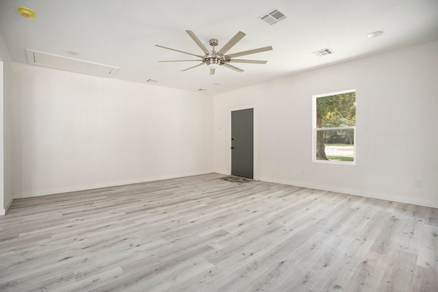 spare room featuring light hardwood / wood-style flooring and ceiling fan