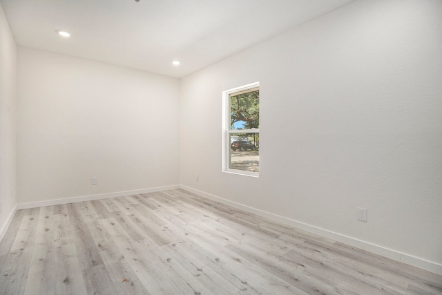 unfurnished room featuring light hardwood / wood-style floors