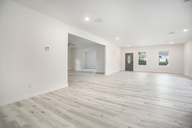 unfurnished living room featuring light hardwood / wood-style floors and ceiling fan