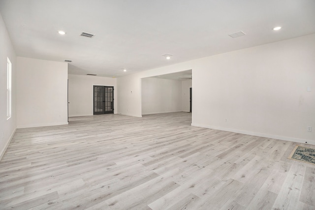 spare room with light hardwood / wood-style flooring