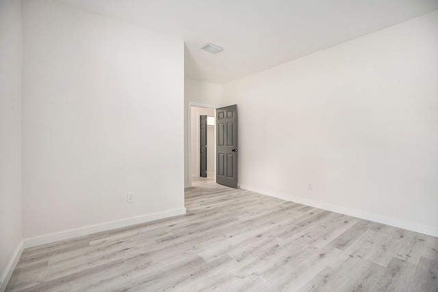 spare room with light wood-type flooring