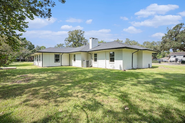 back of house with a yard