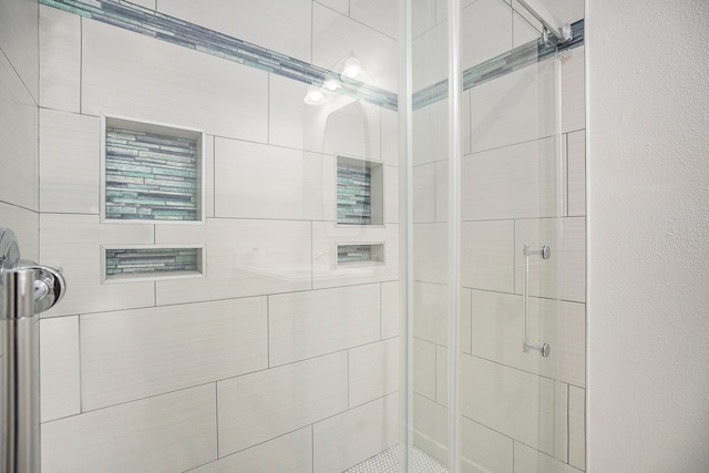 bathroom featuring an enclosed shower