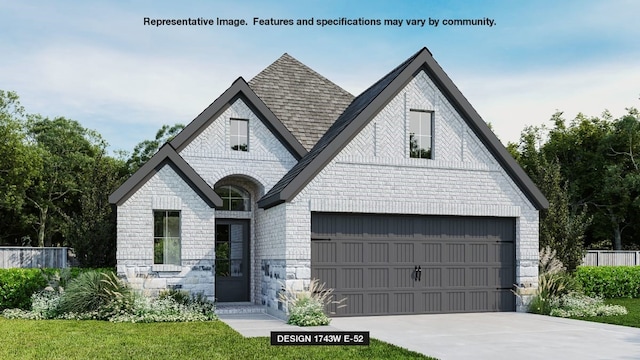 view of front of house featuring a front yard and a garage