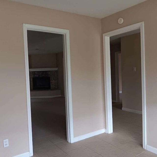 hallway featuring light tile patterned flooring