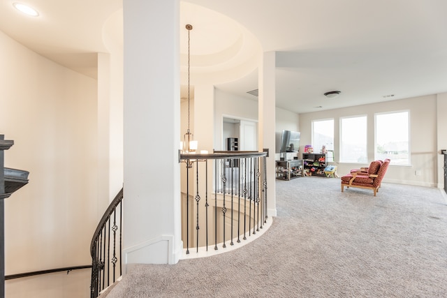 corridor with light colored carpet