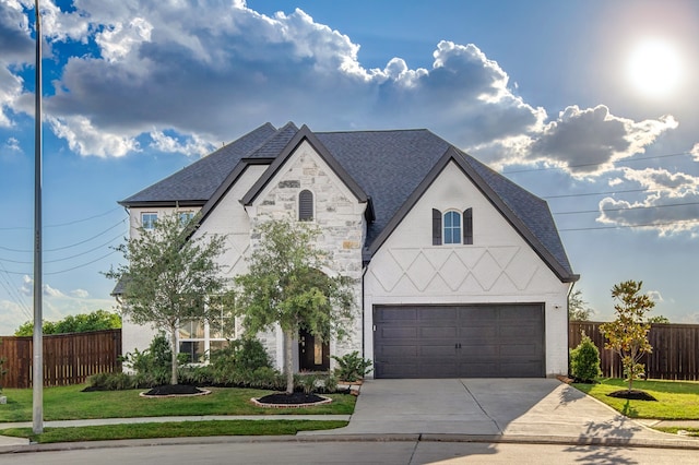 view of front of house featuring a front yard and a garage