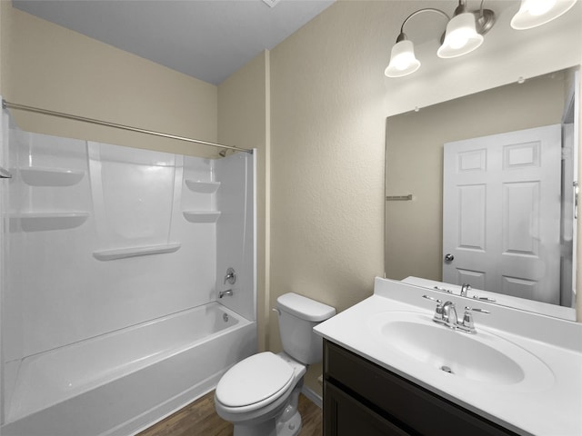 full bathroom featuring vanity, toilet,  shower combination, and hardwood / wood-style flooring