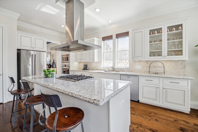 kitchen featuring a kitchen island, island range hood, dark wood-type flooring, white cabinetry, and stainless steel appliances