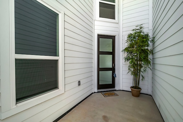 doorway to property featuring a patio area