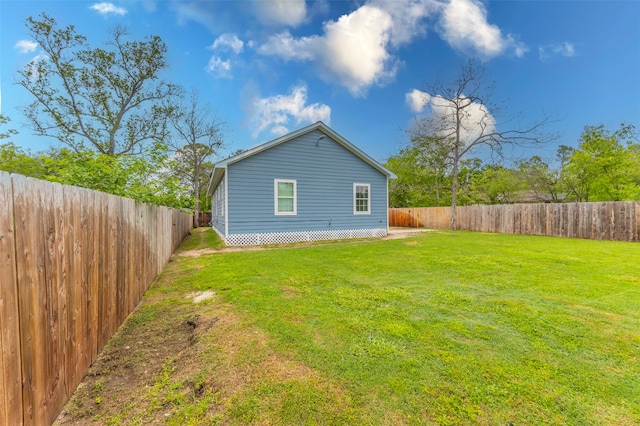 back of property featuring a lawn