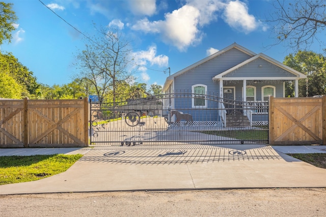 view of gate featuring a porch