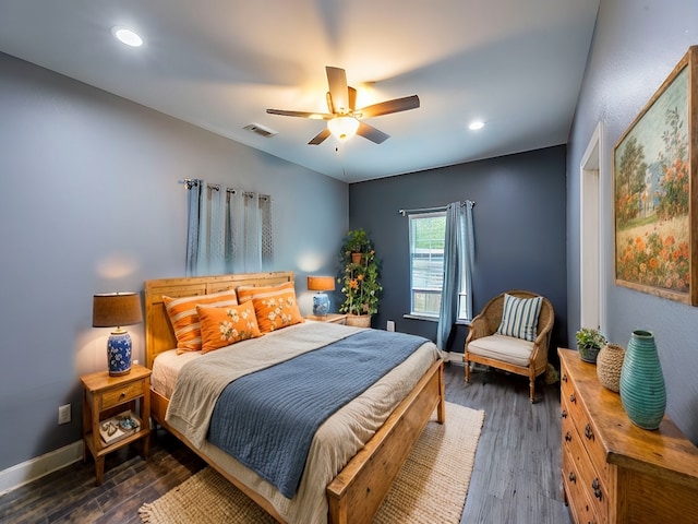 bedroom featuring ceiling fan and dark wood-type flooring