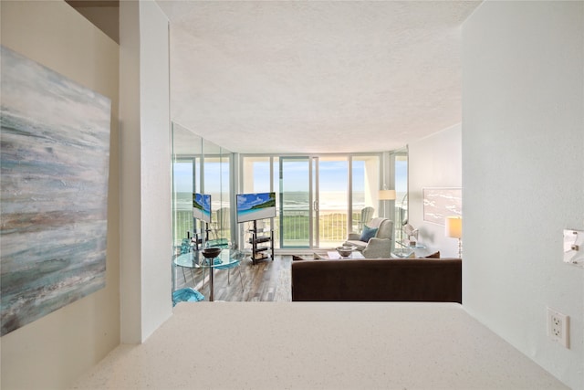 interior space with a textured ceiling and floor to ceiling windows