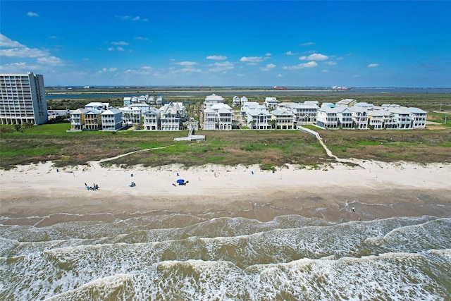 aerial view featuring a view of the beach and a water view