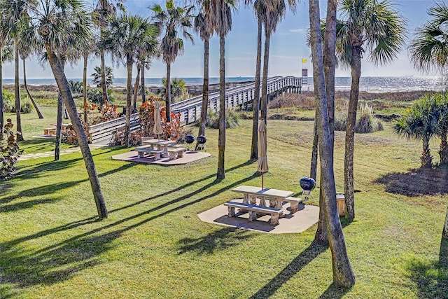 view of yard with a water view and a patio area