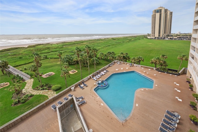 view of pool with a beach view, a patio, and a water view