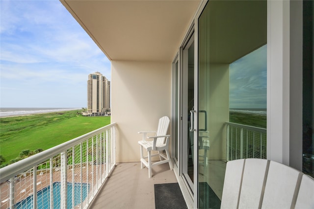 balcony featuring a water view