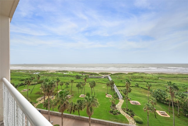 balcony with a view of the beach and a water view