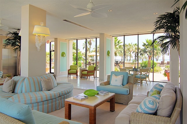 interior space featuring floor to ceiling windows and ceiling fan